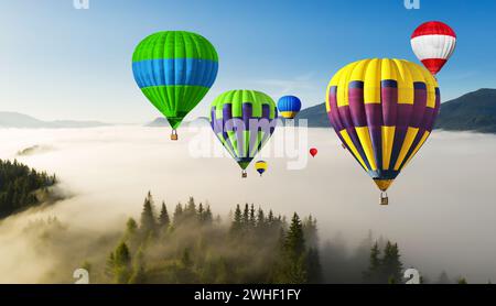 Bright hot air balloons flying over foggy mountains. Banner design Stock Photo