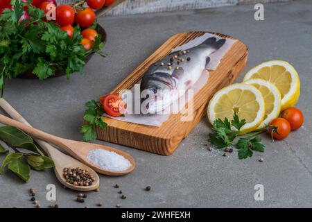 Fresh uncooked sea bass fish on white background Stock Photo - Alamy