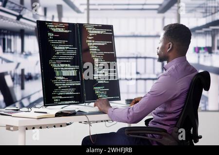 Software Programmer Or Coder Man Using Office Computer Stock Photo