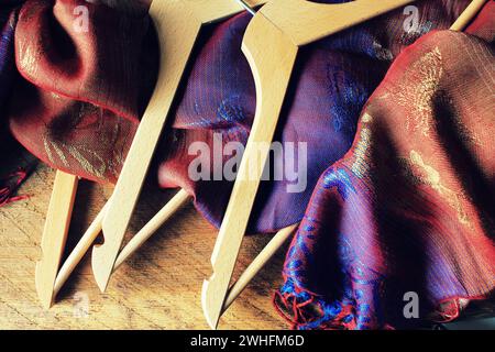 Wooden empty clothes hangers on wooden background. What nothing to wear concept. Woman clothing Stock Photo