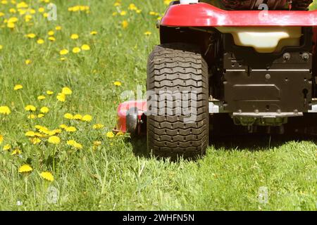 Cutting the grass of on a tractor lawn mower Stock Photo