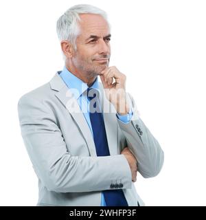 Thinking, senior man and suit in studio with white background for future ideas. Smart, businessman and professional with formal experience and wisdom Stock Photo