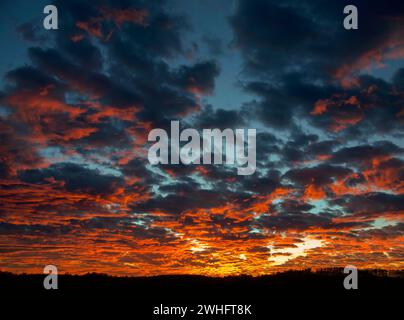 Dramatic sunset with heavy cloud cover Stock Photo