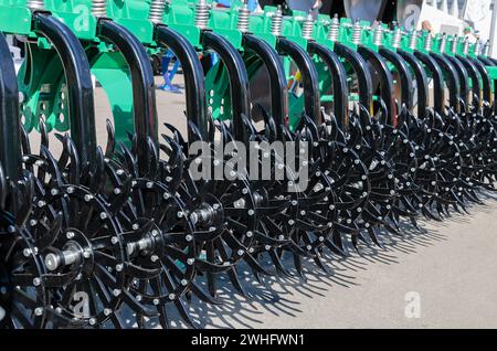Agricultural machine for sowing, preparing and cultivating soil for farmers, close up Stock Photo