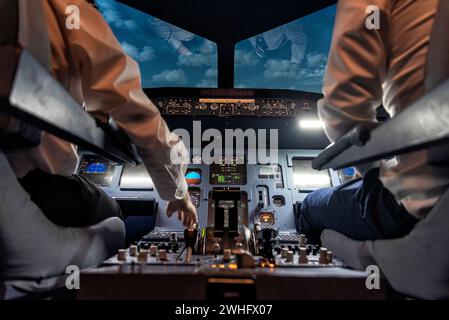 Pilots in a cockpit in an airplane Stock Photo