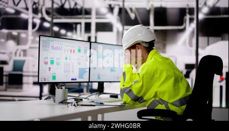 Unhappy Engineer Operator Using SCADA System At Industrial Plant Stock Photo