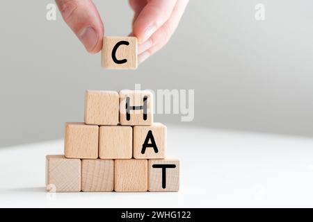 Word Chat on board game square plastic tile pieces, isolated on a white background. Stock Photo