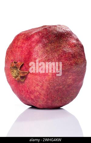 Close up of Whole pomegranate over white background Stock Photo