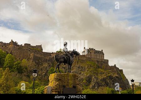 The Royal Scots Greys Monument in Edinburgh with castle hill and castle in the background Stock Photo