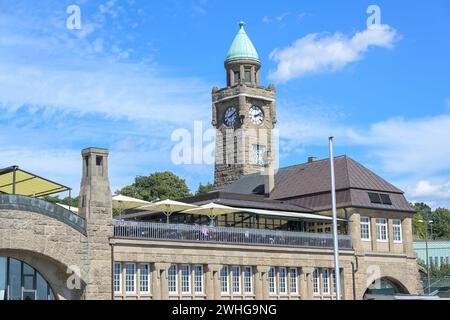 Hamburg LandungsbrÃ¼cken St. Pauli piers, terminal building with clock tower and water level indicator on the river Elbe, famous Stock Photo