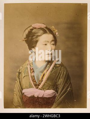Studio portrait of Japanese women, ...Japan  Hand-coloured with watercolour Photographic Print circa 1870s Stock Photo