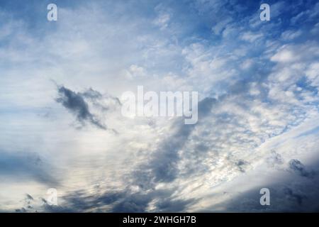Light and dark clouds on the blue sky on a stormy day, natural background, concept for weather forecast and meteorology, copy sp Stock Photo