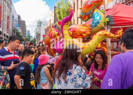 Sydney Australia 10 Feb 2024: Lunar New Year kicked off in earnest today with big crowds of people flocking to China Town in Sydney to eat and celebrate. Inflated toy dragons were not surprisingly very popular among young children with 2024 being the year of the Dragon. Food from many different nations was selling from restaurants and specially set up stalls to keep everyone fed and happy. Credit: Stephen Dwyer / Alamy Live News Stock Photo