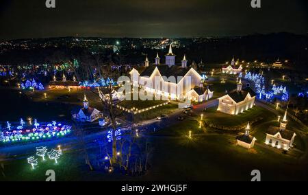 Aerial View of a Large Christmas Drive Thru Display, with Multi Colored Lights, Seen at Night Stock Photo