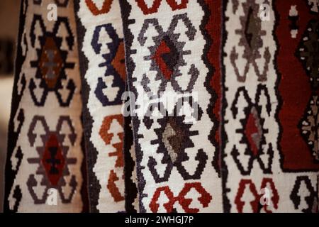 Close up shot of some colorful hand made carpets in a shop. Stock Photo