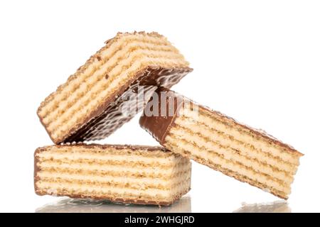Several sweet chocolate wafers, macro, isolated on white background. Stock Photo
