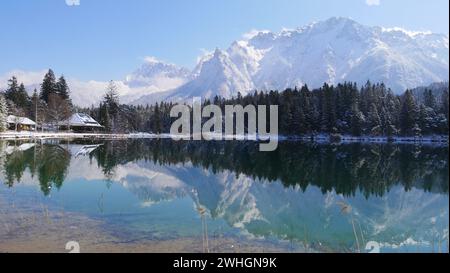 Wonderful sunny day at Lautersee near Mittenwald with reflection and view of the Karwendel mountains Stock Photo