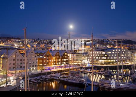 Europe, Norway, Tromso Harbour at Night with moored Boats in the Wintertime Stock Photo