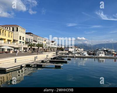 Embankment of a resort town with bright colorful houses and moored boats at the pier Stock Photo
