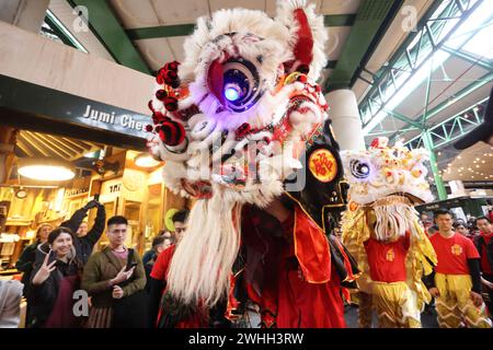 London, UK, 10th February 2024. The start of the Chinese or Lunar New Year festival in trendy Borough Market, as the Year of the Dragon was welcomed in and traditional dragon dancers performed around the stalls. The Year of the Dragon is forecast to being change with new opportunities possible. Credit : Monica Wells/Alamy Live News Stock Photo