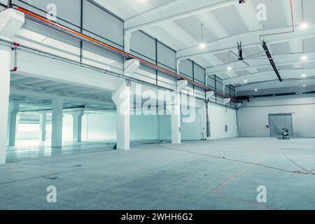 Empty moderna and spacious warehouse currently under work. Stock Photo