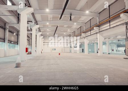 Empty moderna and spacious warehouse currently under work. Stock Photo