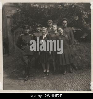 Vintage amateur group photo of happy Soviet people after ww2,  Germany, 1945-1948 Stock Photo