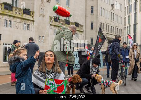 Leeds, UK. 10 FEB, 2024. Young child and mother attend Watermelon protest in city square . Credit Milo Chandler/Alamy Live News Stock Photo