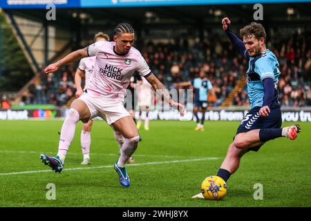 Wycombe Wanderers's Kieran Sadlier battles for the ball against Peterborough United's Jadel Katongo during the Sky Bet League One match at Adams Park, High Wycombe. Picture date: Saturday February 10, 2024. Stock Photo