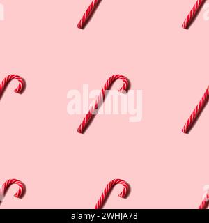 Seamless Christmas texture made of candy cane and shadow on pink background Stock Photo