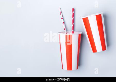 Two Empty striped paper cup on a blue background Stock Photo