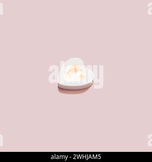 Shining isometrics Heart with sparkle inside on pink background. Love concept Stock Photo