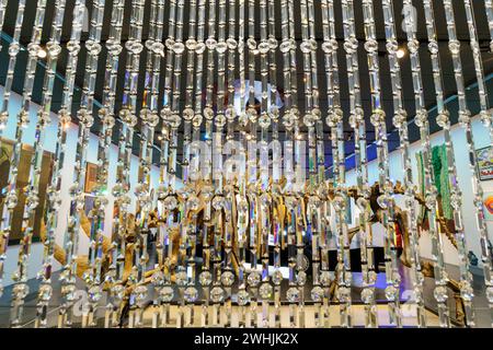 Curtain of Swarovski crystals and fossilized skeleton of Siberian woolly rhinoceros (Coelodonta antiquitatis) Stock Photo