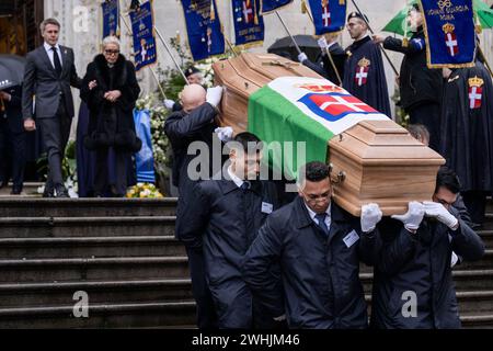 Turin, Italy. 10 February 2024. Pallbearers carry the coffin of Vittorio Emanuele of Savoy following his funeral ceremony at the Turin Cathedral as Marina Doria of Savoy and Emanuele Filiberto of Savoy walks in the background. Vittorio Emanuele of Savoy was the son of Umberto II of Savoy, the last king of Italy, and he died in Geneva on February 3, 2024. Credit: Nicolò Campo/Alamy Live News Stock Photo