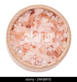 White and pink Himalayan salt in a wooden bowl on a white isolated background, top view Stock Photo