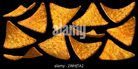 Falling corn chips, hot Mexican nachos isolated on black background Stock Photo