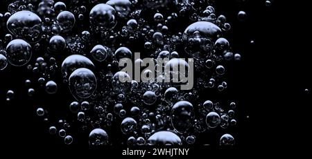 Soda water bubbles splashing underwater against black background. Soda liquid texture that fizzing and floating up to surface like a explosion in unde Stock Photo