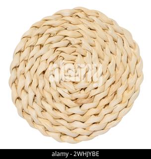 Woven straw coaster for cup, plate, glass for the dining table on a white isolated background. Stock Photo