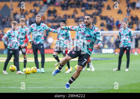 Wolverhampton, UK. 10th Feb, 2024. Brentford's Neal Maupay warms up ahead of the Premier League match between Wolverhampton Wanderers and Brentford at Molineux, Wolverhampton, England on 10 February 2024. Photo by Stuart Leggett. Editorial use only, license required for commercial use. No use in betting, games or a single club/league/player publications. Credit: UK Sports Pics Ltd/Alamy Live News Stock Photo