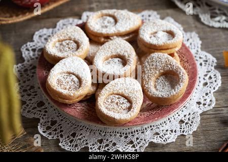 Linzer cookies in the shape of Easter eggs on a plate Stock Photo
