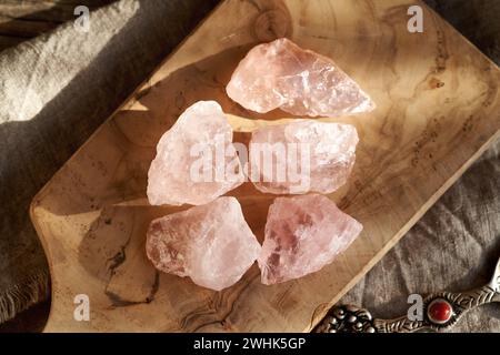 Five rose quartz stones on a table Stock Photo