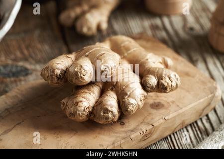 Fresh ginger root on a wooden cutting board Stock Photo