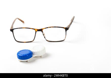 Glasses and contact lenses on a white table isolated on a white background Stock Photo