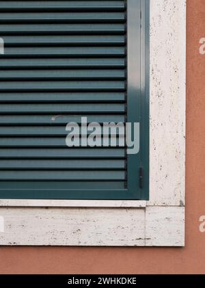 Single window with green shutters set on the wall, Belgrade, Serbia Stock Photo