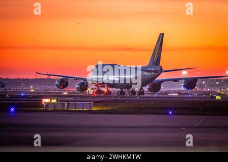 Early in the morning in front of sunrise at the airport, a jumbo jet stands ready for take-off on the runway, Fraport, Frankfurt am Main, Hesse Stock Photo