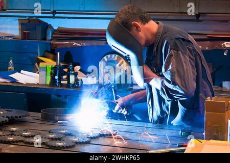 A welder in the workshop in the metal industry, 30, 35, years Stock Photo