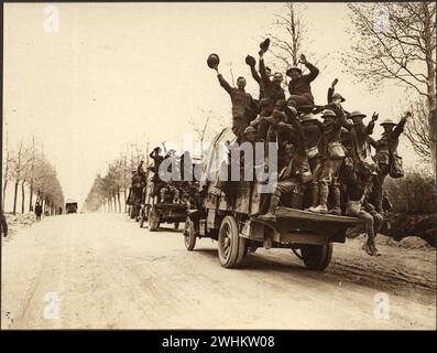 Victorious Canadians celebrating after fighting on Vimy Ridge. Group of soldiers riding military truck waving and cheering after a war win.  Images from Canadian Forces in First World War France 1917 Stock Photo