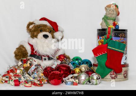 teddy bear, paper chain, Christmas stockings still life on a white background Stock Photo