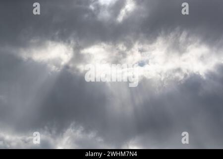 White sunlight shining through grey clouds.Shot in Sweden, Scandinavia Stock Photo