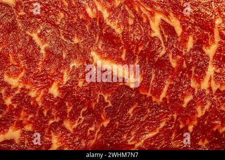 Raw wagyu hereford mixed beef with marbled fat as close up background. Stock Photo